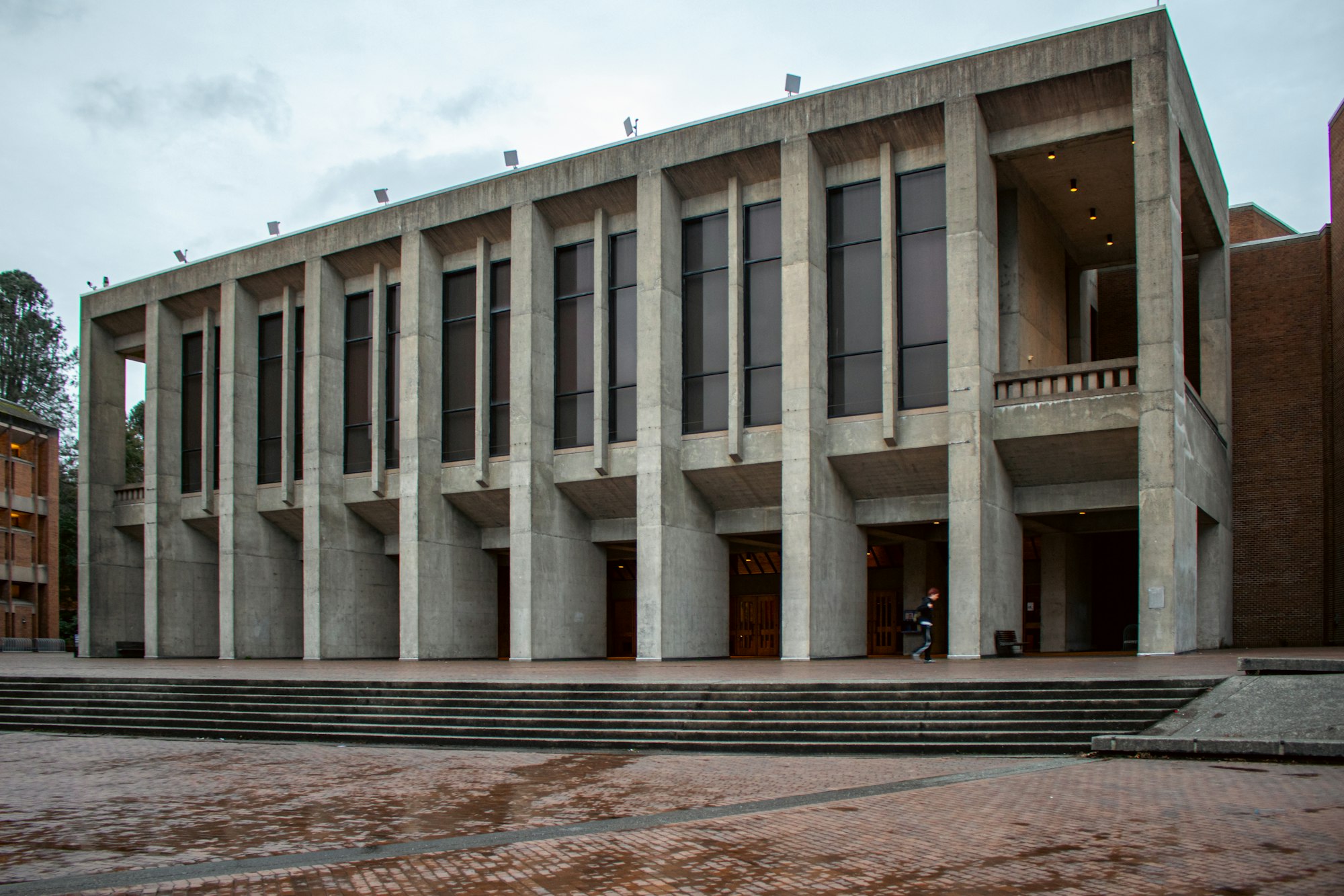 Exterior of a large civic building with concrete columns