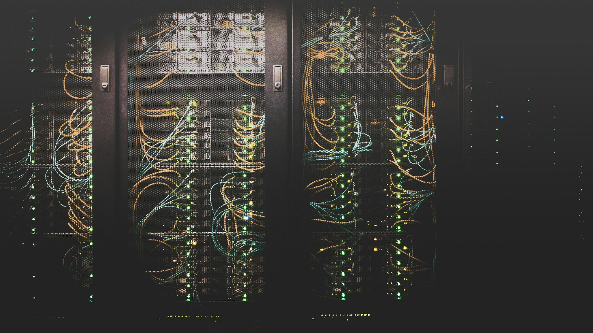 Server racks with illuminated network cables